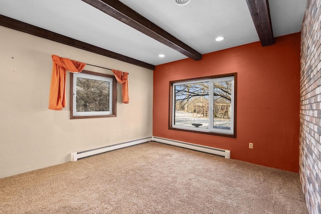 carpeted spare room with baseboard heating and beamed ceiling