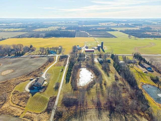 birds eye view of property featuring a rural view