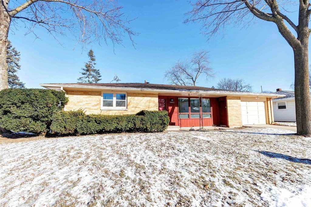 single story home with a garage