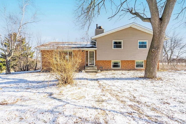 view of snow covered house