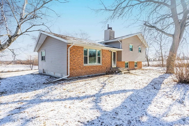 view of snow covered house