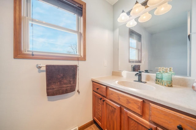 bathroom featuring vanity and plenty of natural light