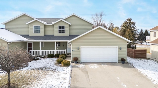 view of front of property with a garage and a porch