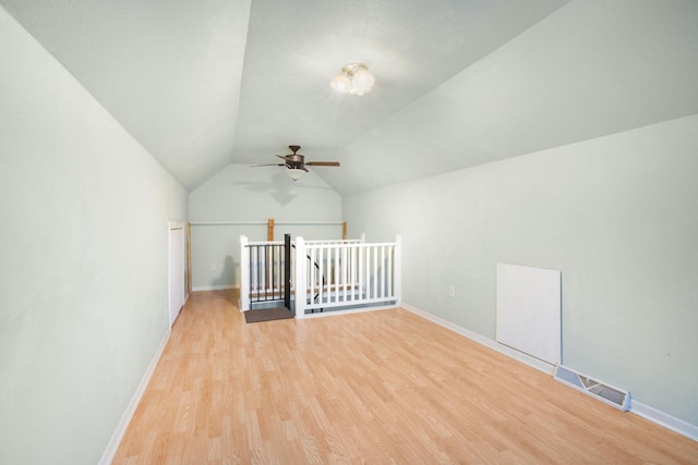 bonus room featuring ceiling fan, light wood-type flooring, and lofted ceiling