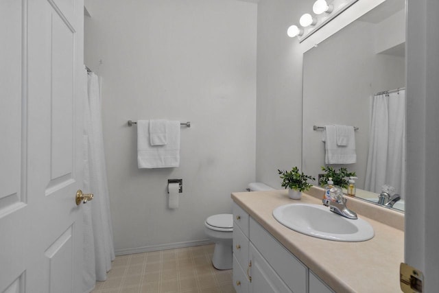 bathroom featuring toilet and vanity