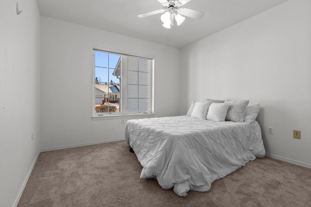 bedroom featuring ceiling fan and light colored carpet