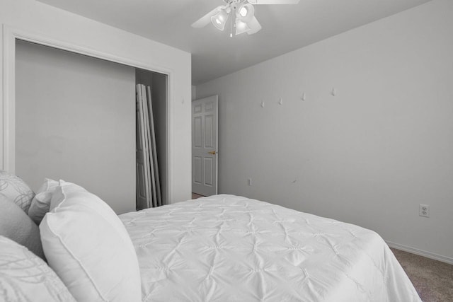 bedroom featuring ceiling fan and carpet