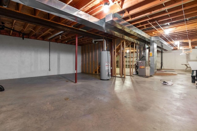 basement with water heater and heating unit