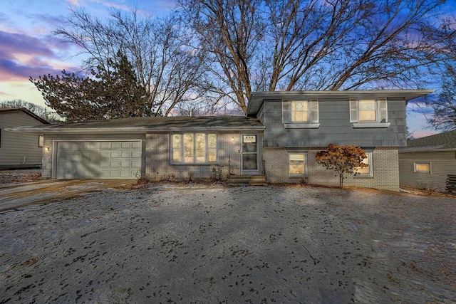 split level home featuring a garage