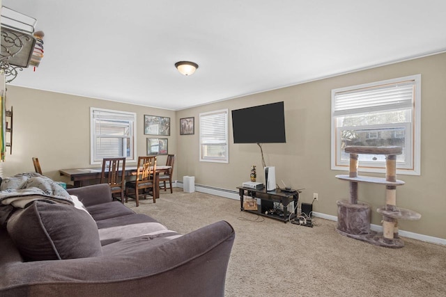 living room with baseboard heating and carpet