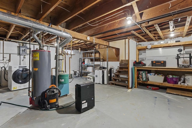 basement with gas water heater, washing machine and dryer, and electric panel