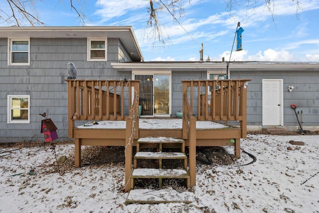 view of snow covered deck