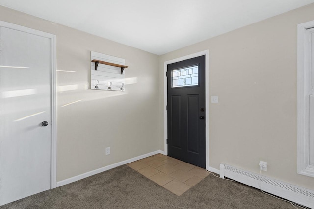 entrance foyer featuring a baseboard radiator and carpet flooring