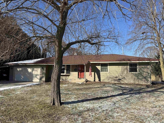 ranch-style house featuring a garage