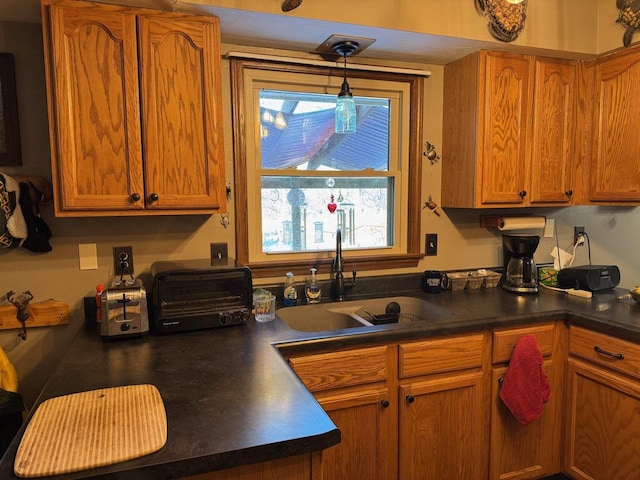 kitchen with hanging light fixtures and sink