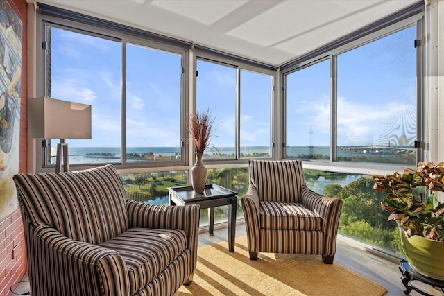 sunroom / solarium with a water view