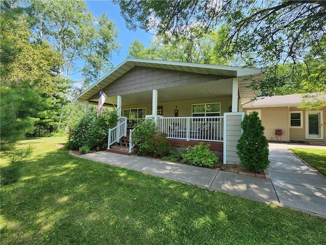 view of front of property with a porch and a front yard