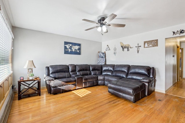 living room featuring ceiling fan and light wood-type flooring