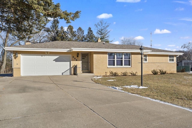 single story home with a front lawn and a garage