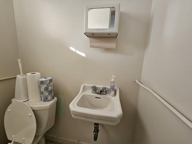 bathroom with toilet and sink