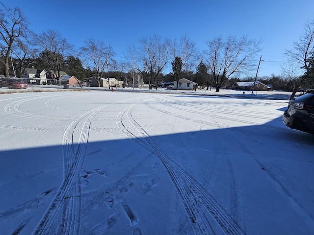 view of yard layered in snow