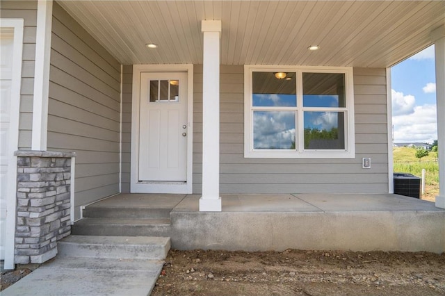 doorway to property featuring central AC