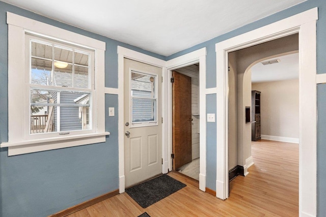 foyer entrance featuring hardwood / wood-style floors