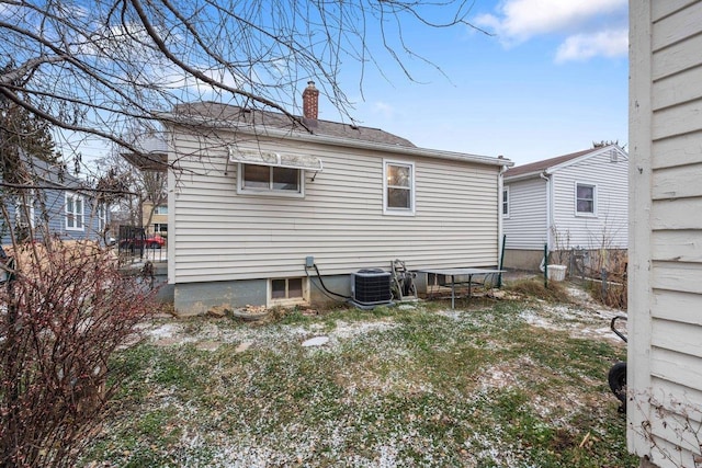 rear view of house with central AC