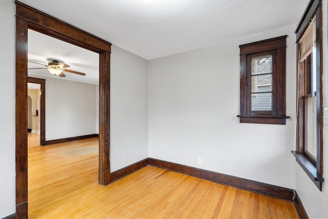 spare room featuring wood-type flooring and ceiling fan