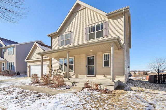 view of front of home with a garage and covered porch