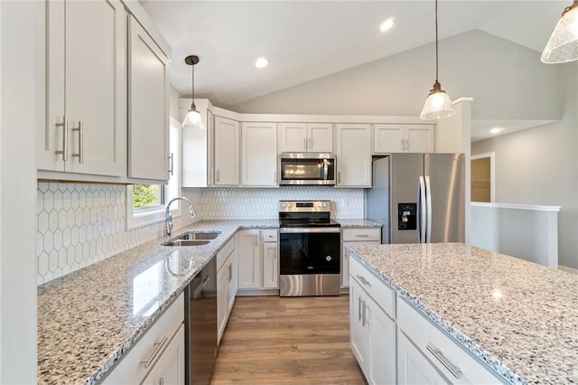 kitchen featuring sink, stainless steel appliances, and white cabinets