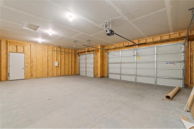 garage featuring a garage door opener