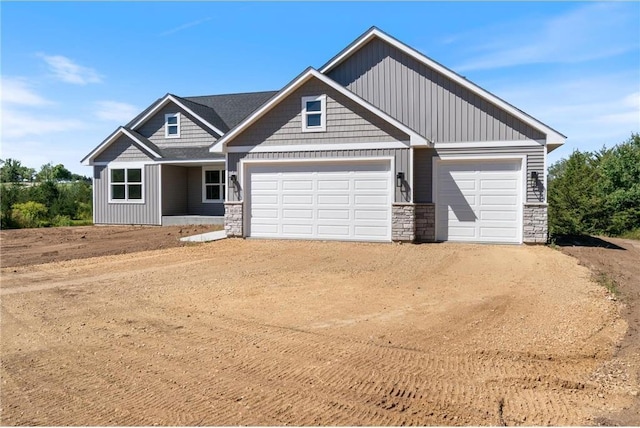 craftsman inspired home with a garage