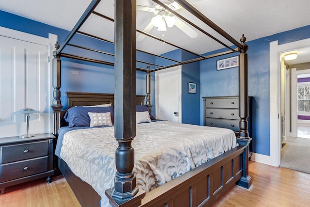 bedroom featuring light wood-type flooring and ceiling fan