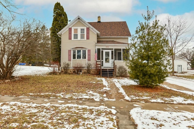 view of front of home with a sunroom