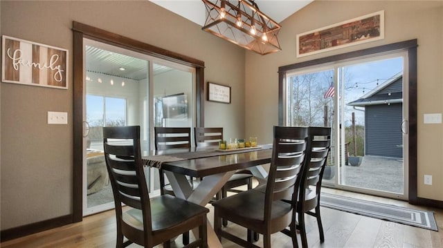 E5695 510th Ave, Menomonie, WI 54751 - dining area with light wood-type flooring and vaulted ceiling