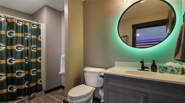 E5695 510th Ave, Menomonie, WI 54751 - bathroom with toilet, hardwood / wood-style flooring, walk in shower, and vanity