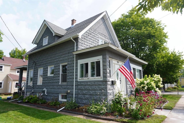 view of home's exterior with a yard