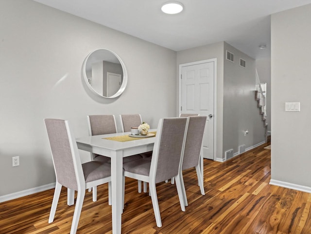 dining area featuring dark hardwood / wood-style floors