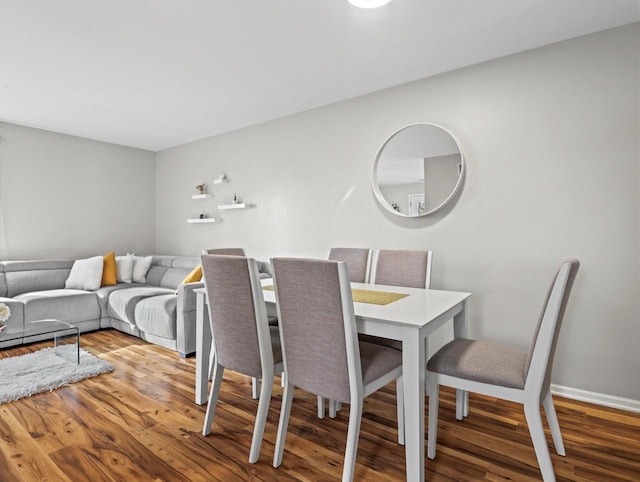 dining space featuring hardwood / wood-style floors