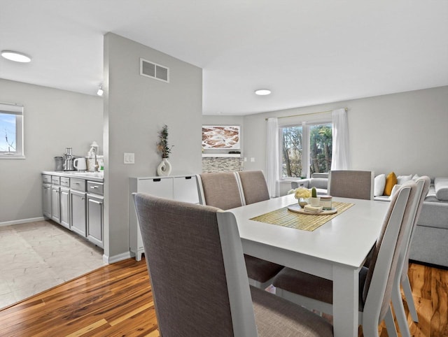 dining room featuring light hardwood / wood-style floors and sink