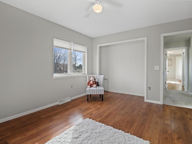 unfurnished room featuring ceiling fan and hardwood / wood-style flooring