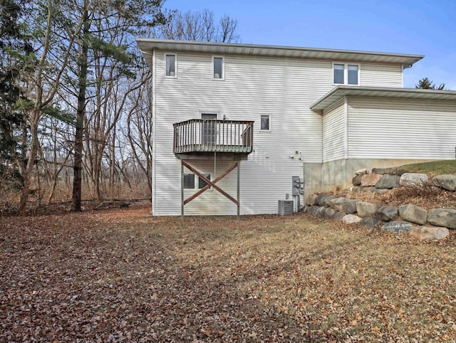 back of house featuring cooling unit