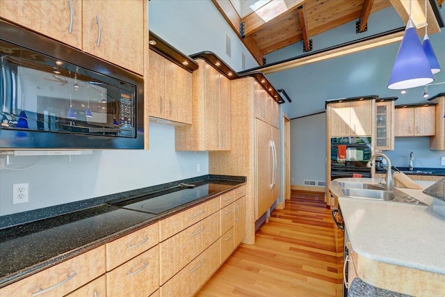 kitchen featuring wooden ceiling, black appliances, pendant lighting, light brown cabinets, and light hardwood / wood-style flooring