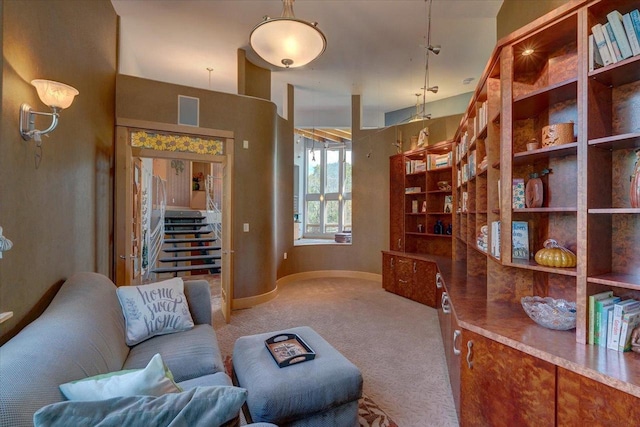 living area featuring light colored carpet