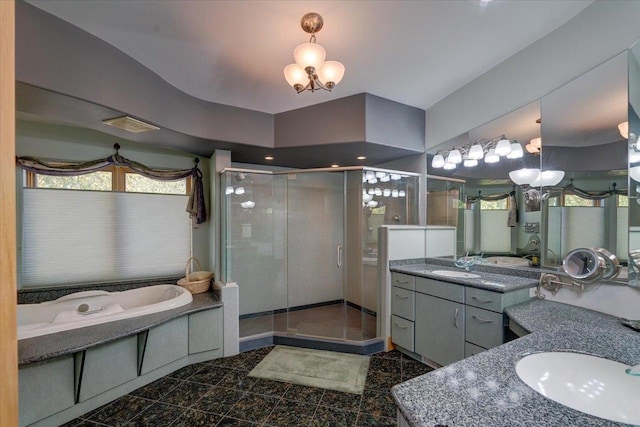 bathroom with vanity and independent shower and bath