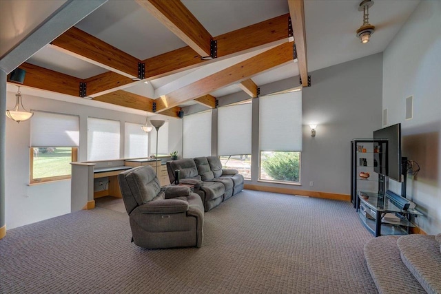 living room with beam ceiling and light colored carpet