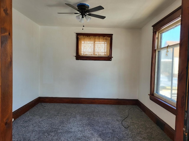 carpeted empty room with ceiling fan