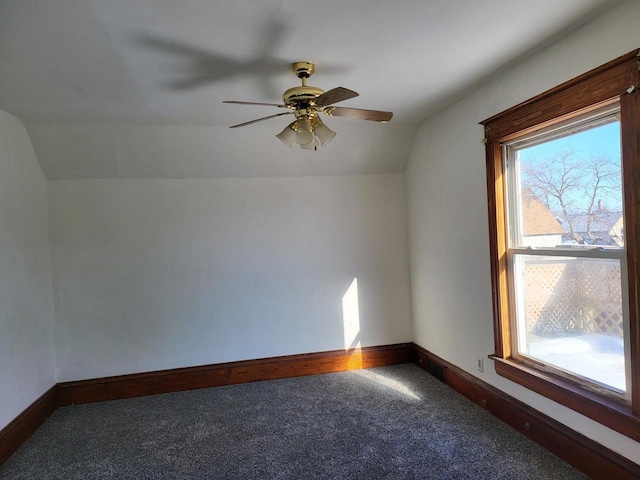 bonus room featuring ceiling fan, vaulted ceiling, carpet floors, and plenty of natural light