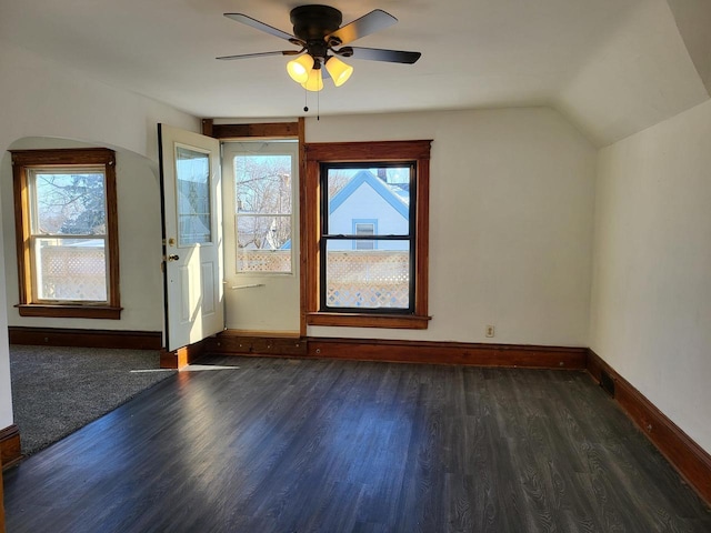 bonus room featuring lofted ceiling, ceiling fan, and dark wood-type flooring